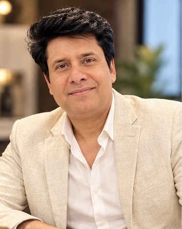 Faisal Raza wearing a light blazer